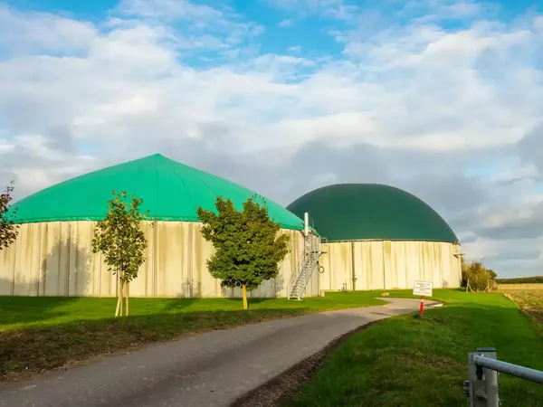 Tranquil scenery of biogas buildings in the field