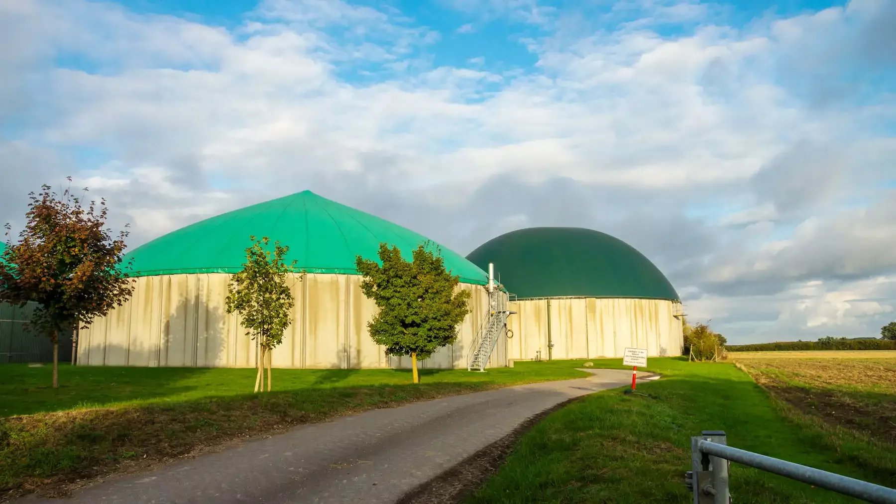 Tranquil scenery of biogas buildings in the field